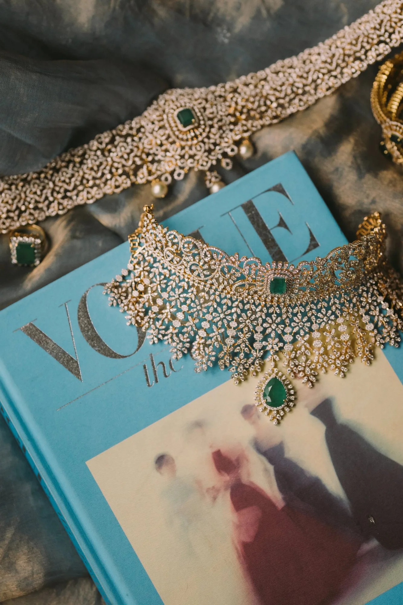 A bride's emerald and diamond jewellery set, laid out before the ceremony