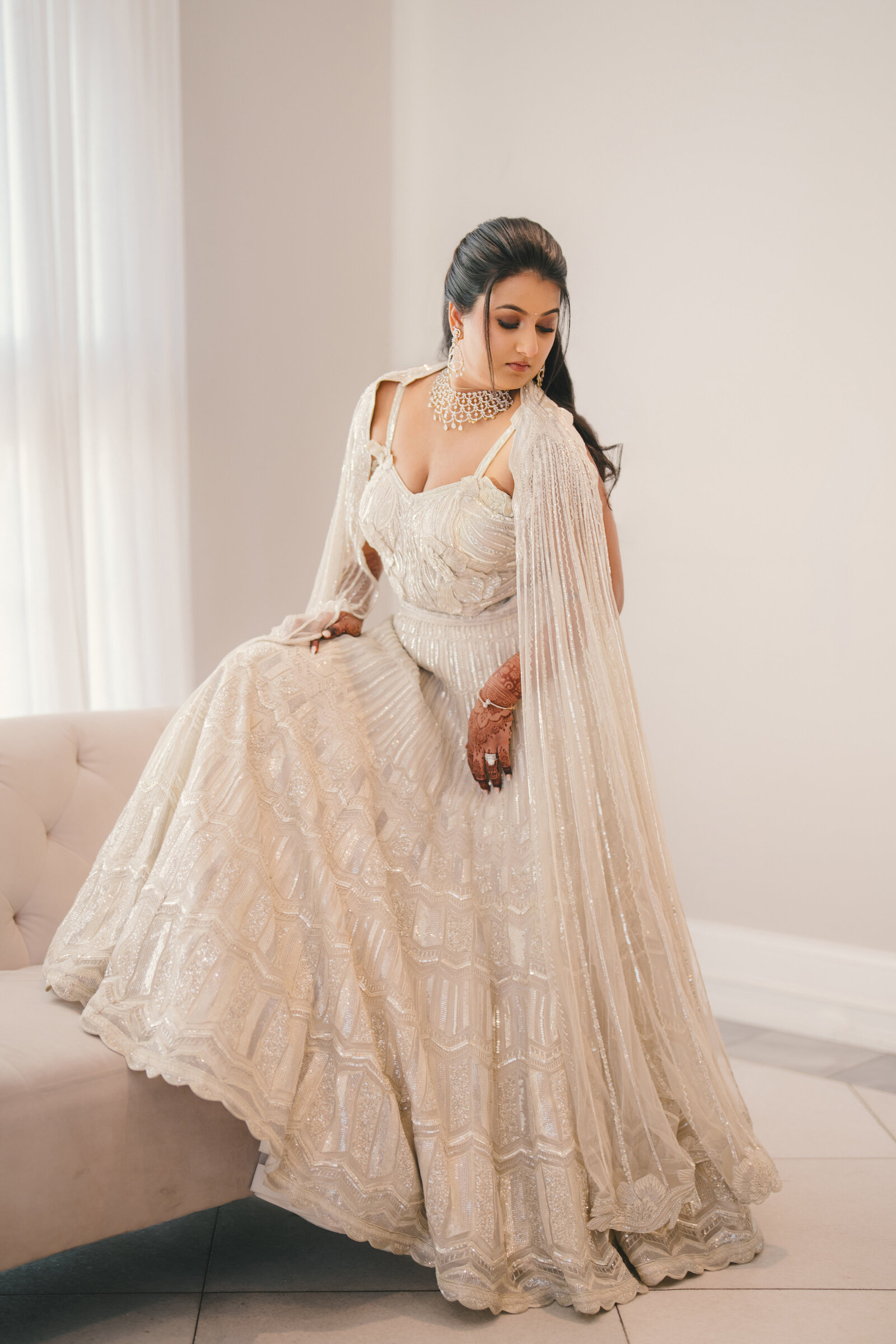 Bride adjusting heirloom gold jewellery